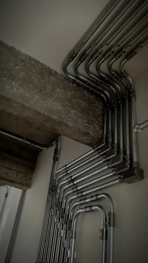 Electrical conduit run on a concrete wall
